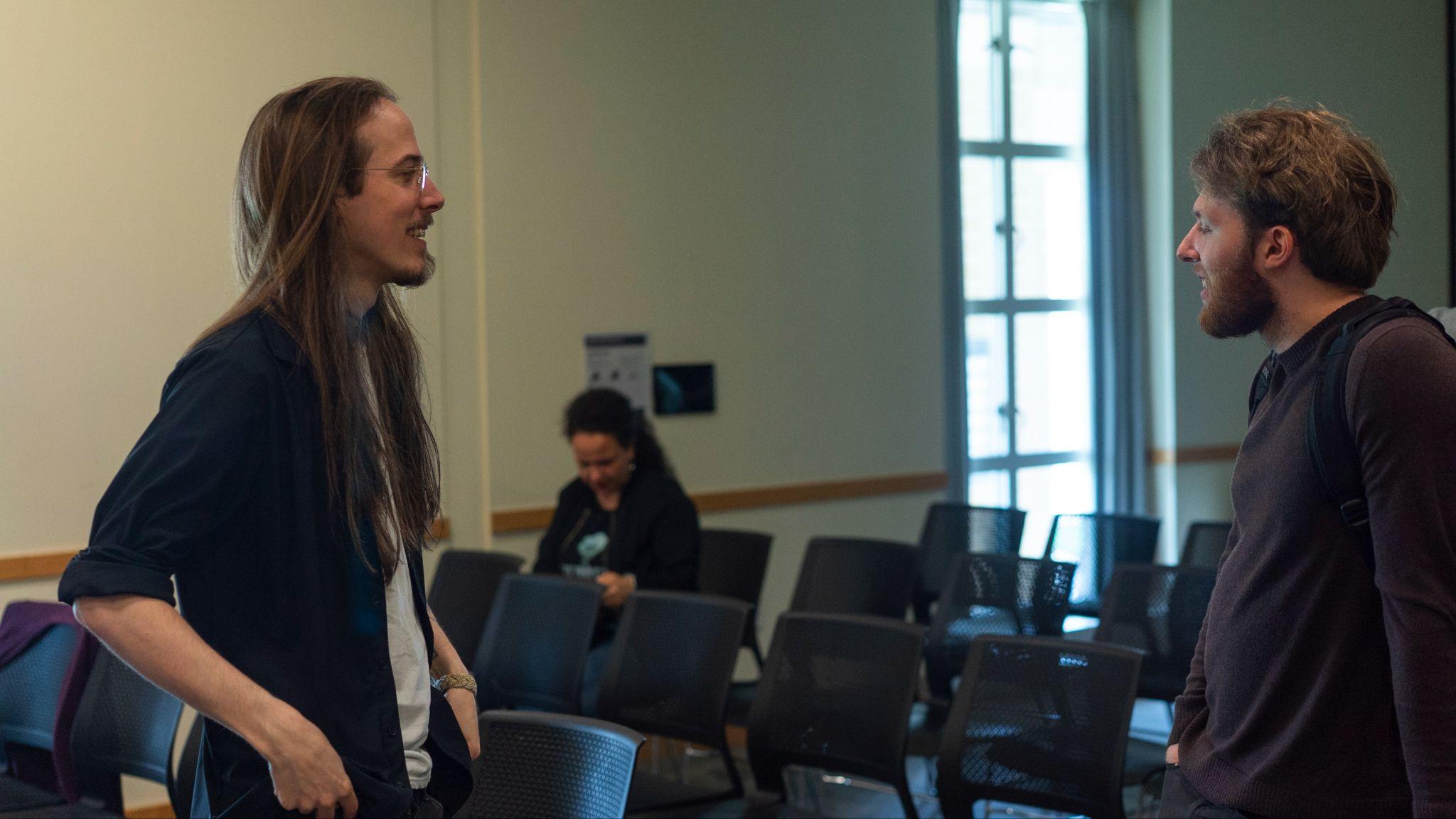 Myself talking with a guest after the talk